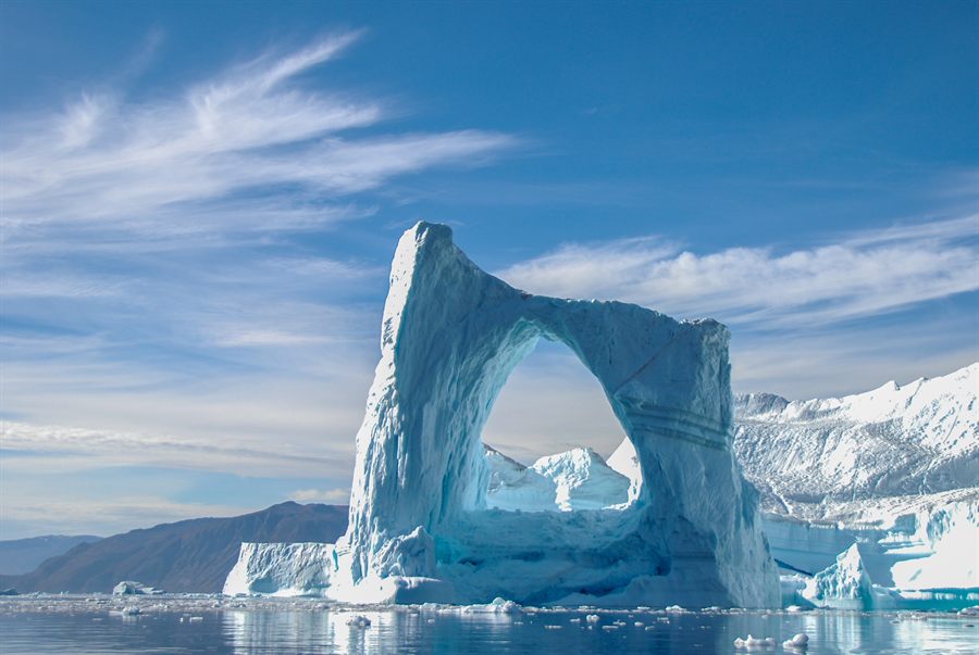 Arched iceberg in polar water