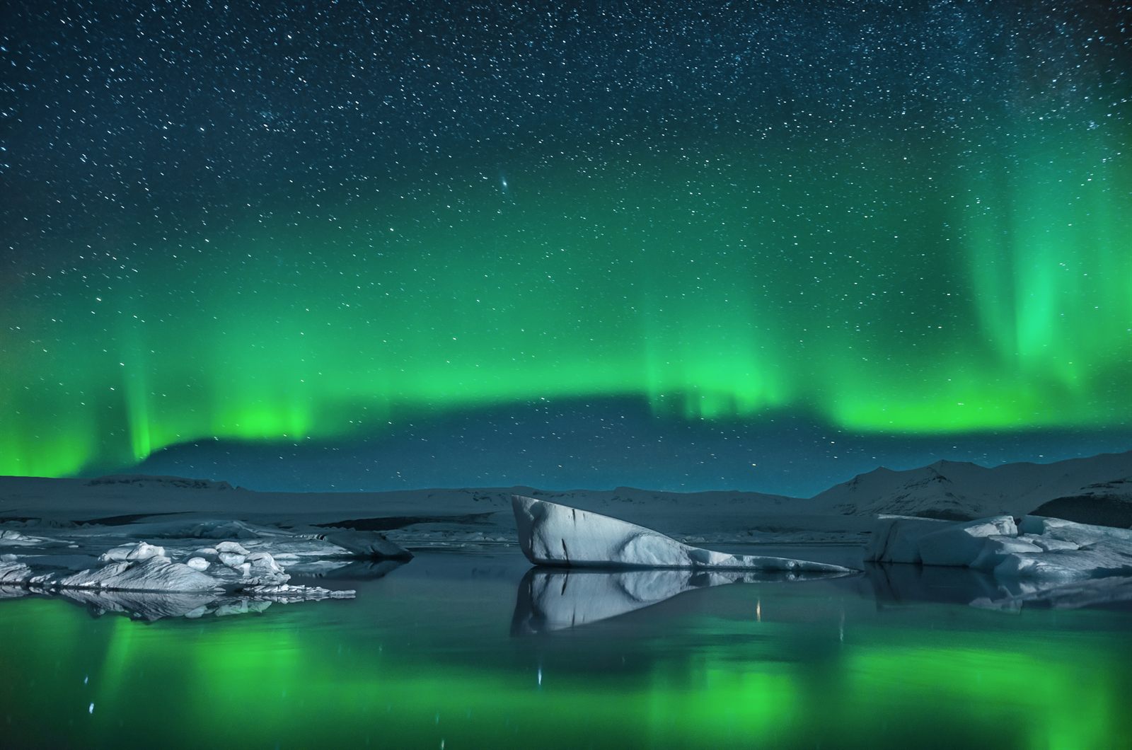 Northern lights over icebergs